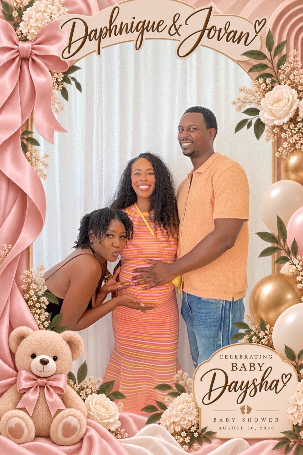 Family posing in a custom floral baby shower photo booth overlay in Los Angeles