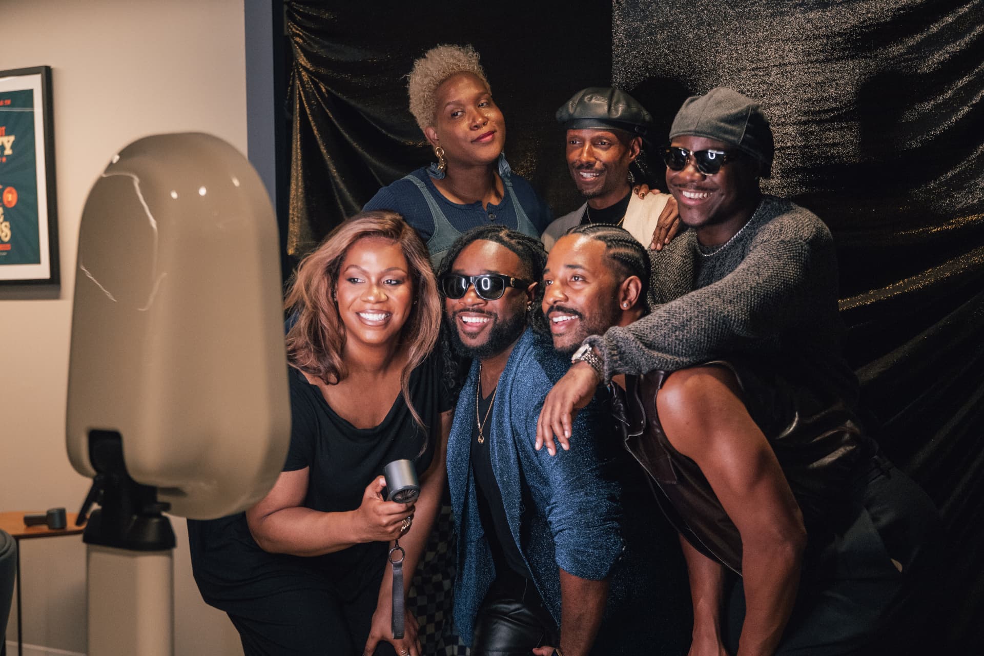 Group posing for a MOMNT photo booth event brand activation